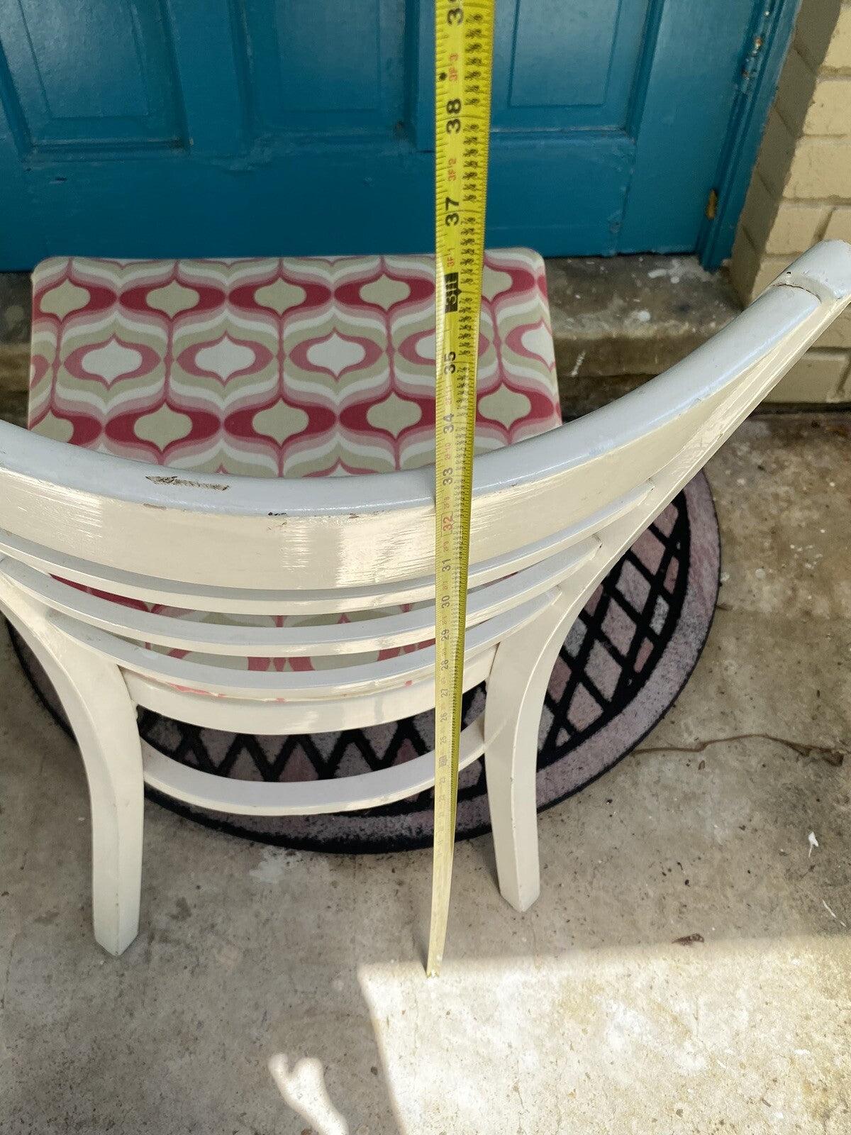 White Wooden Accent Chair With Pink/White Geometric Cushion