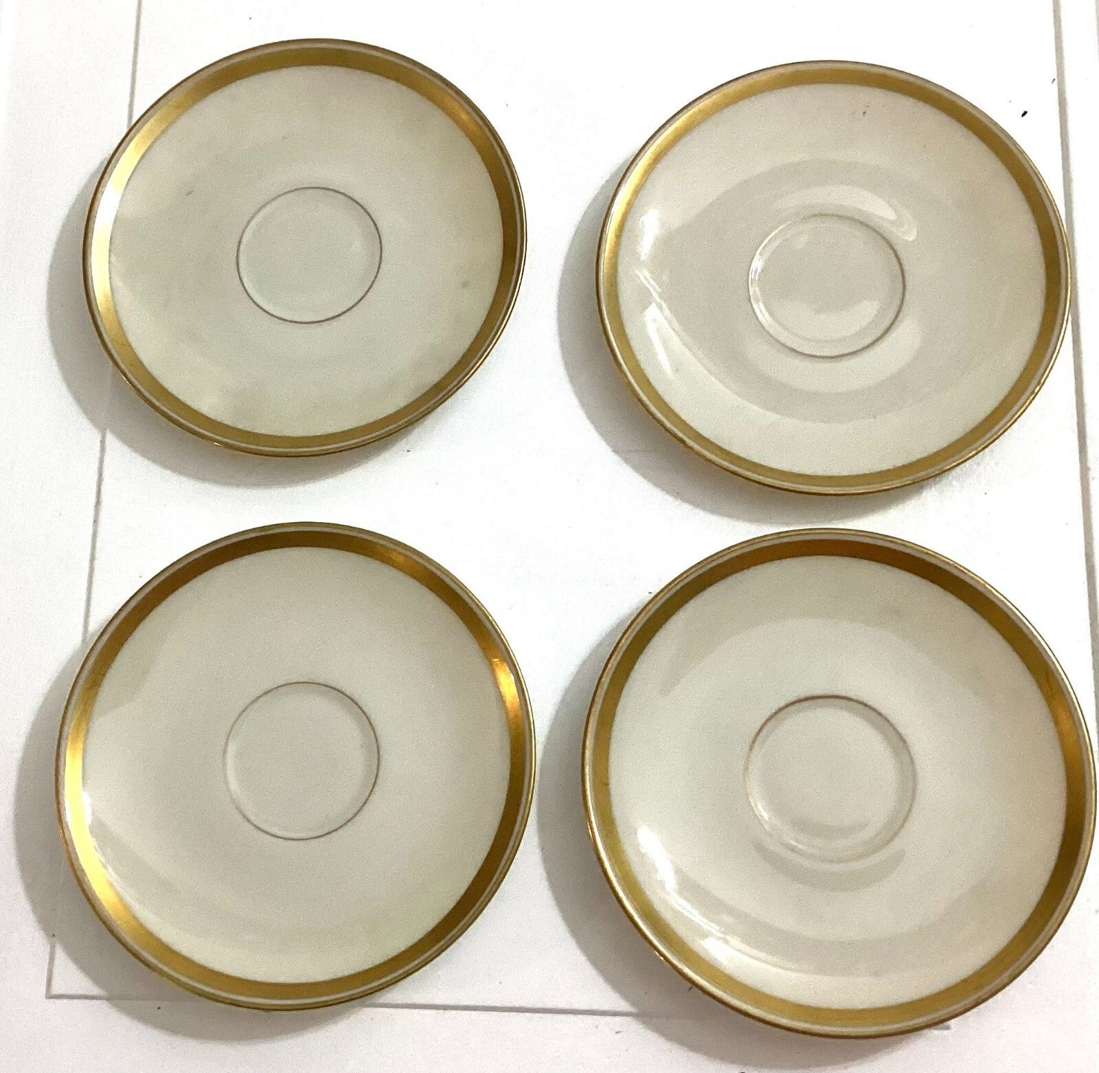 Lot Of 4 Lunning Inc White With Gold Trim Edge Round Shaped Saucers