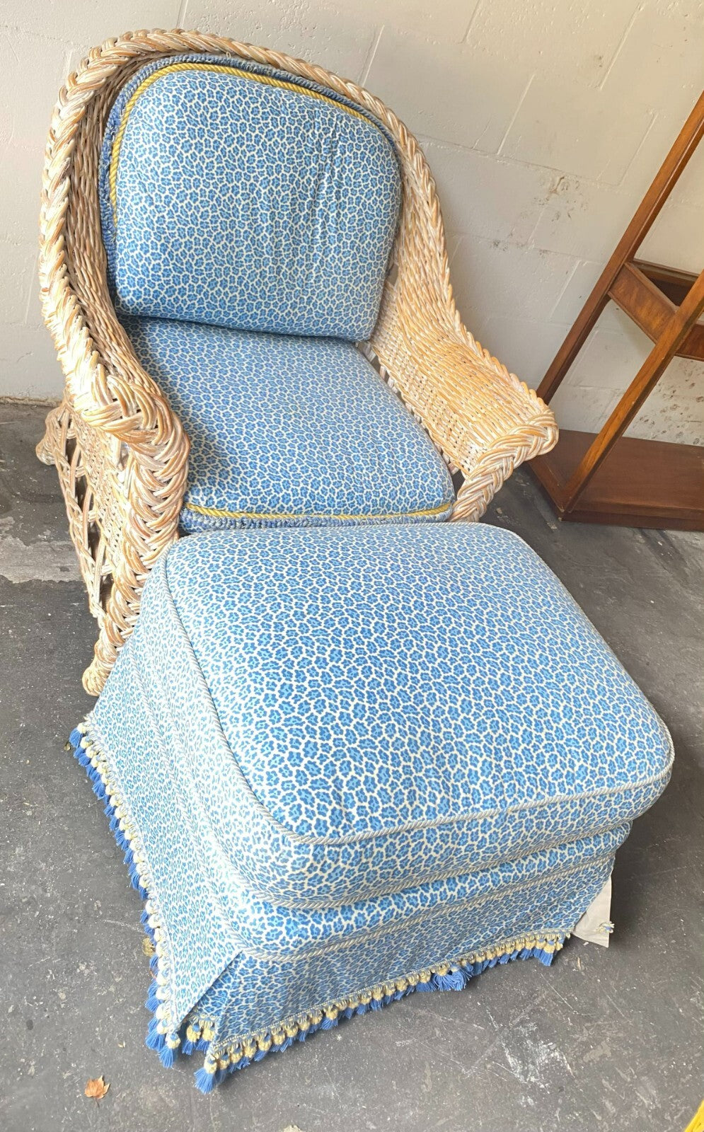 Beige Wicker Chair With Arm Rest Blue Cushion And Square Matching Ottoman