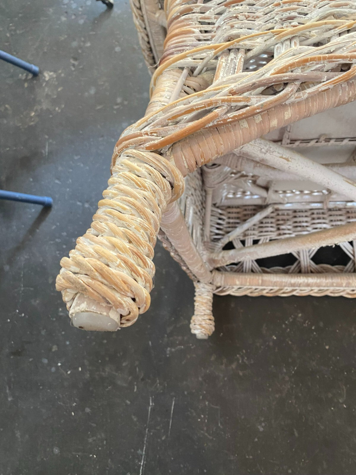 Beige Wicker Chair With Arm Rest Blue Cushion And Square Matching Ottoman
