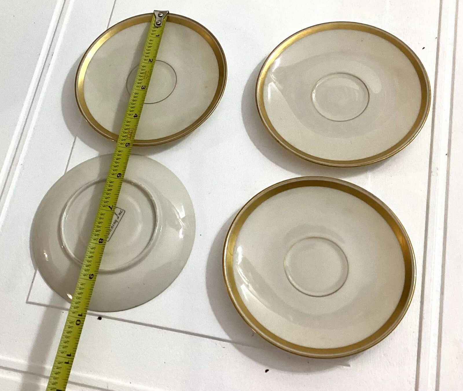 Lot Of 4 Lunning Inc White With Gold Trim Edge Round Shaped Saucers