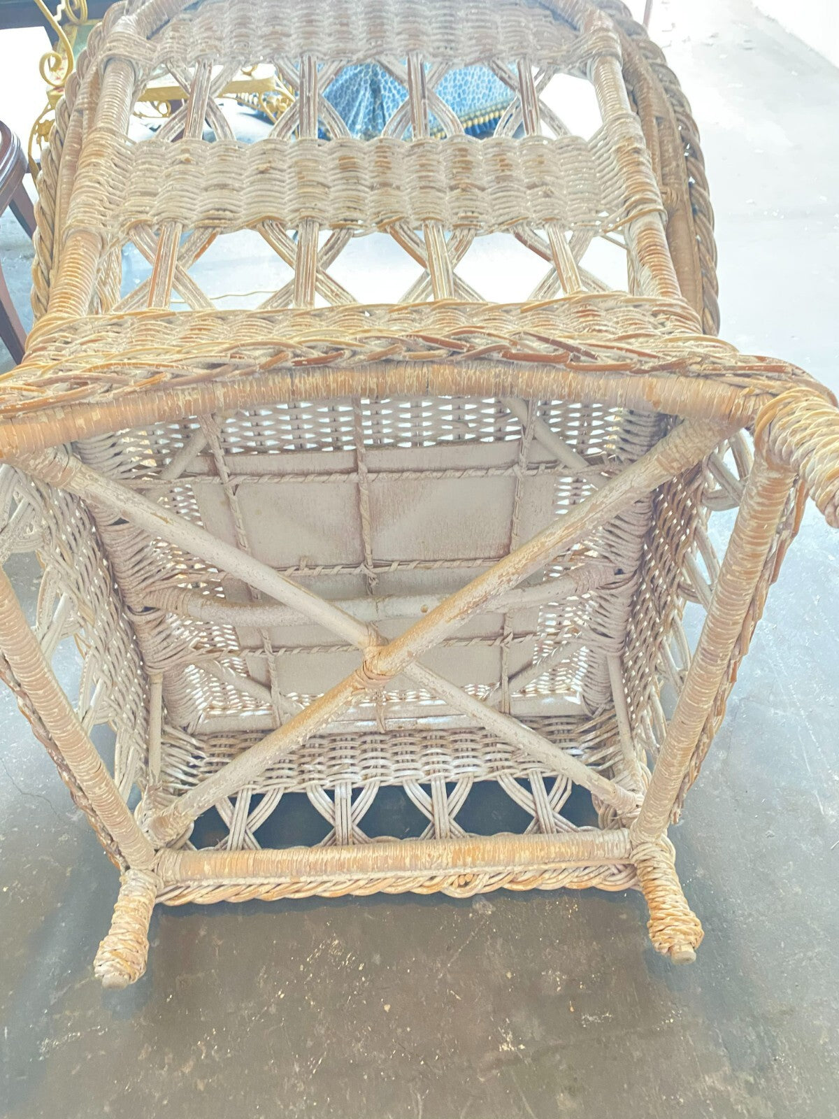 Beige Wicker Chair With Arm Rest Blue Cushion And Square Matching Ottoman