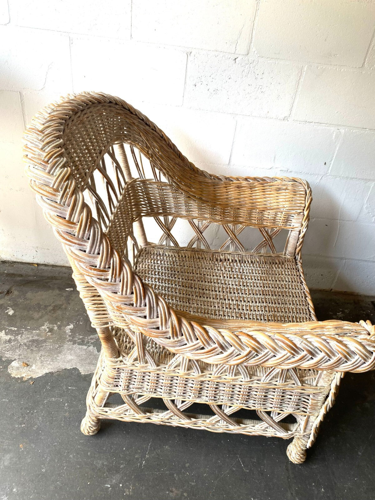 Beige Wicker Chair With Arm Rest Blue Cushion And Square Matching Ottoman