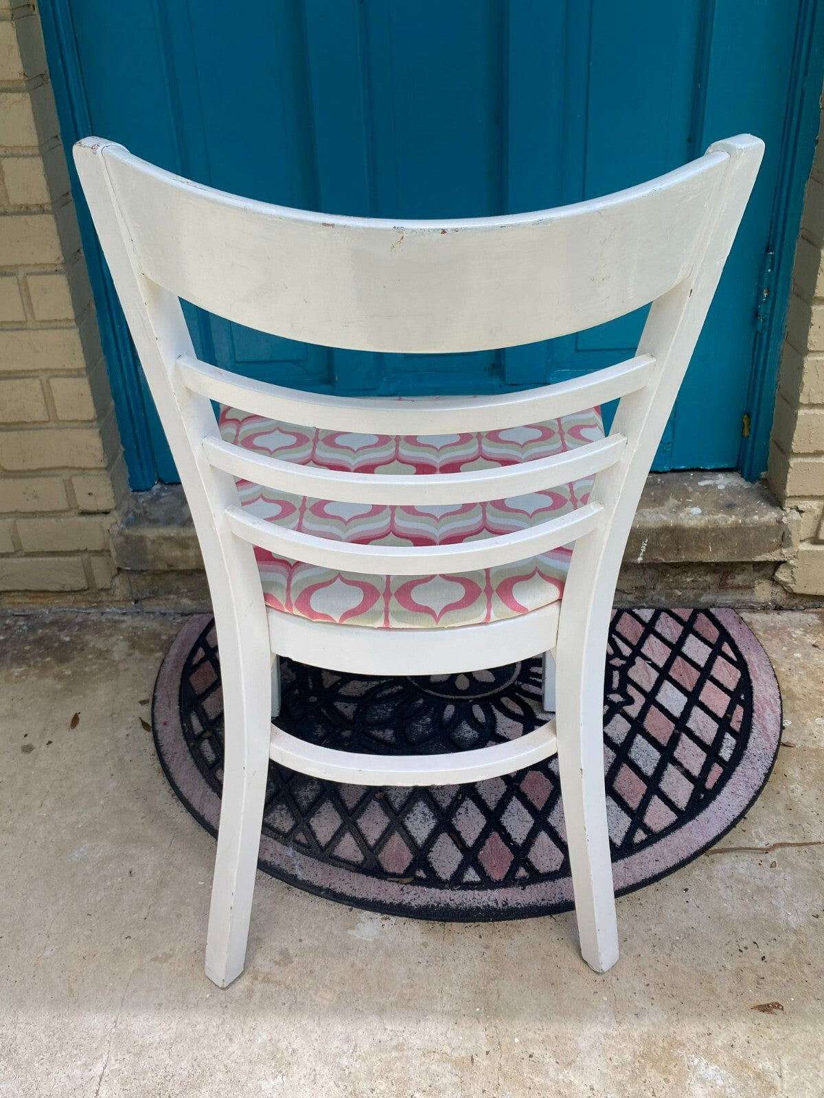 White Wooden Accent Chair With Pink/White Geometric Cushion